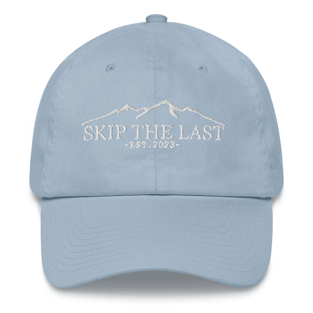 Two More Skip The Last "Skip the Last" light blue unisex embroidered dad hat. Front view