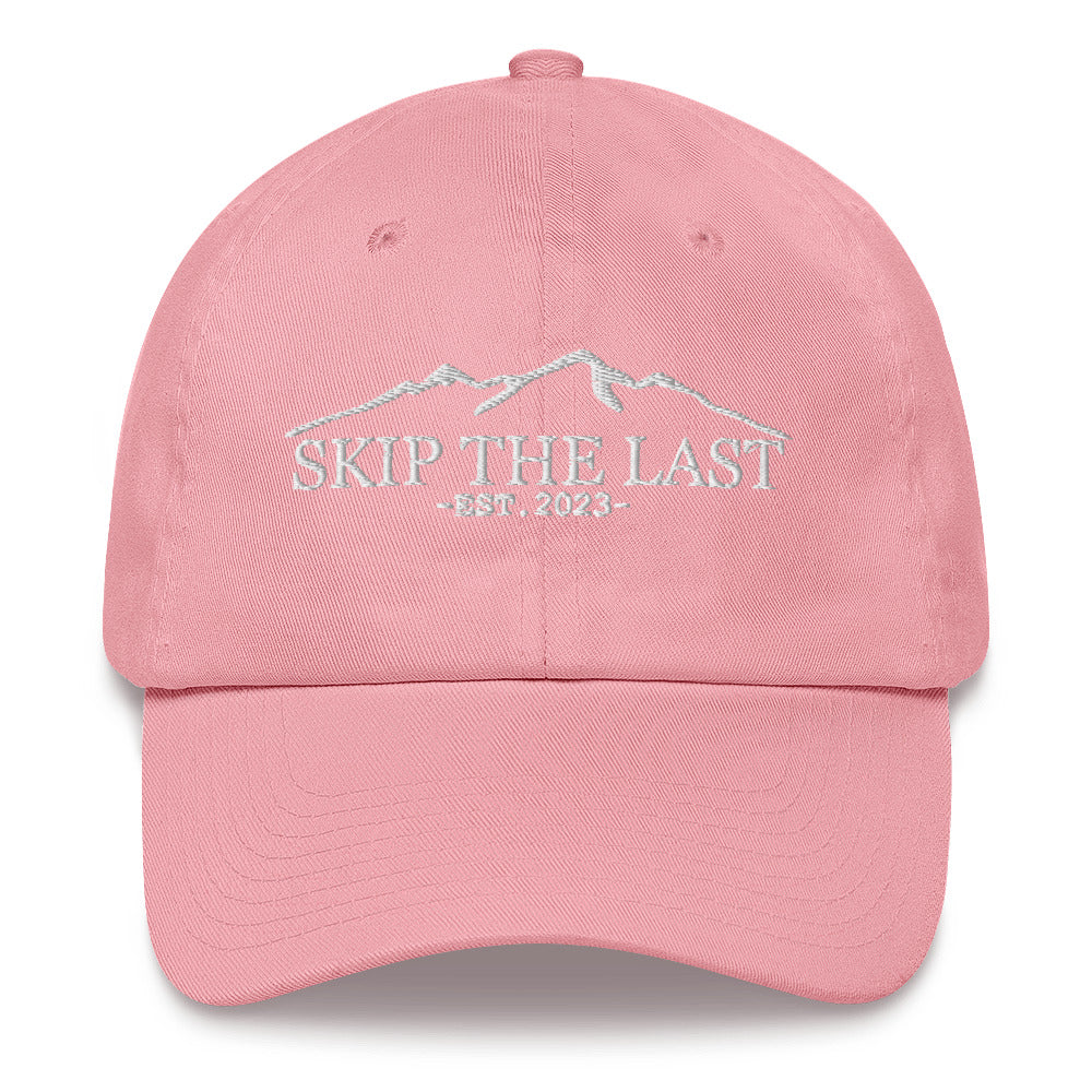 Two More Skip The Last "Skip the Last" pink unisex embroidered dad hat. Front view